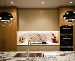 kitchen workspace with marble work surfaces and splashbacks