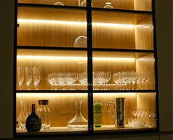 contemporary open cupboard space with LED trim