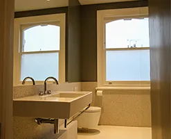 white ceramic bathroom basin with chrome tap and plumbing