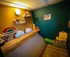 child's playroom with diagonal wooden flooring