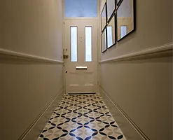 interior of home atrium with artwork on the walls